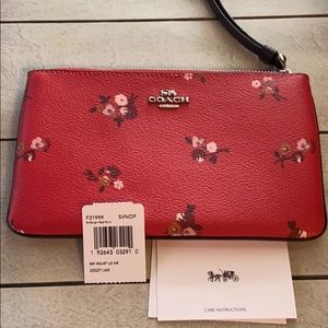 New Coach floral wristlet